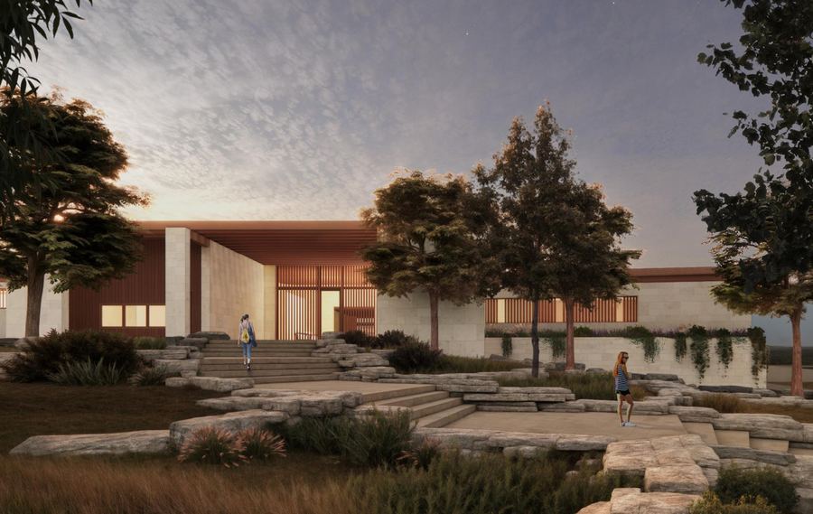 Community building on stone terraces at dusk